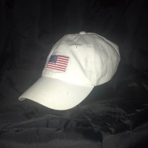A white hat with an American flag upon the front.
